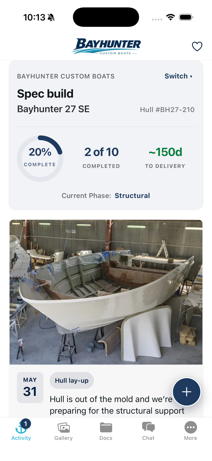 The MyBoatBuild app showing a boat's activity feed — build updates, photos, and progress — inside a builder's branded app